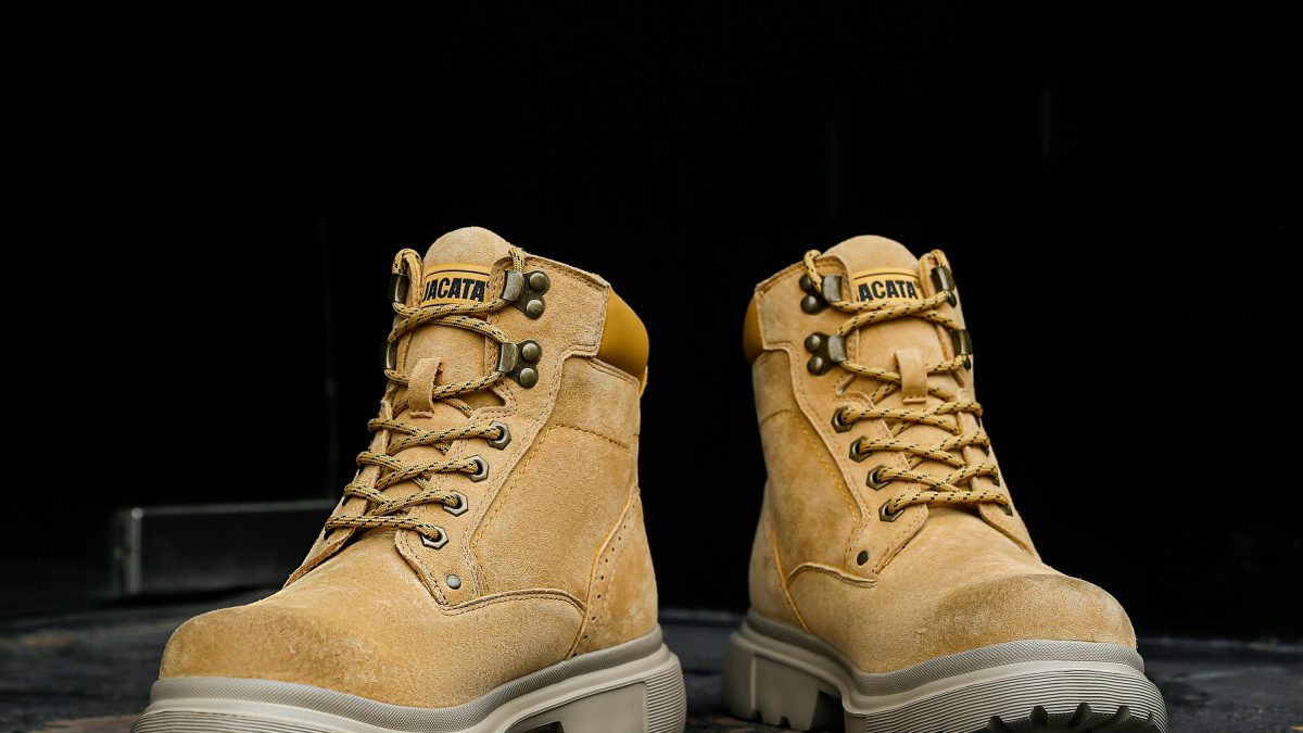 Workers wearing safety boots in a construction and warehouse work environment.