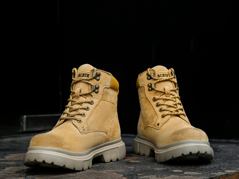 Workers wearing safety boots in a construction and warehouse work environment.